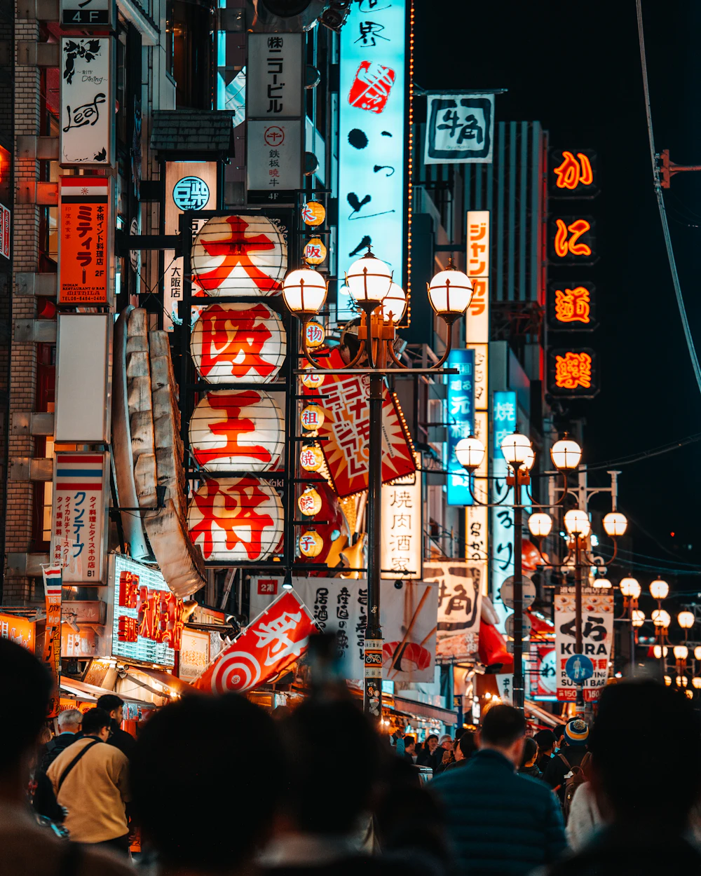 Neon-lit crowded street at night