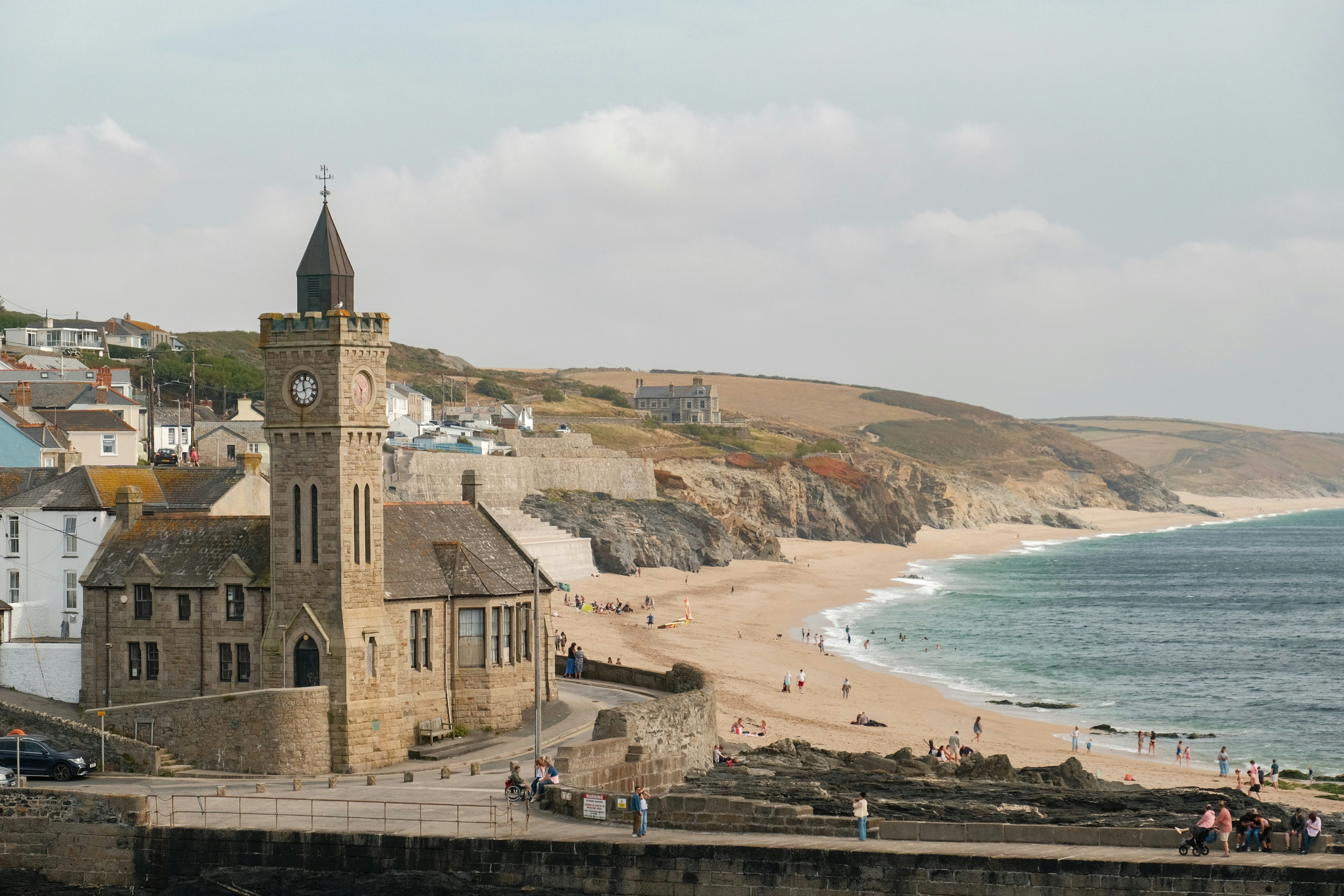 Coastal town with church and beach at high tide