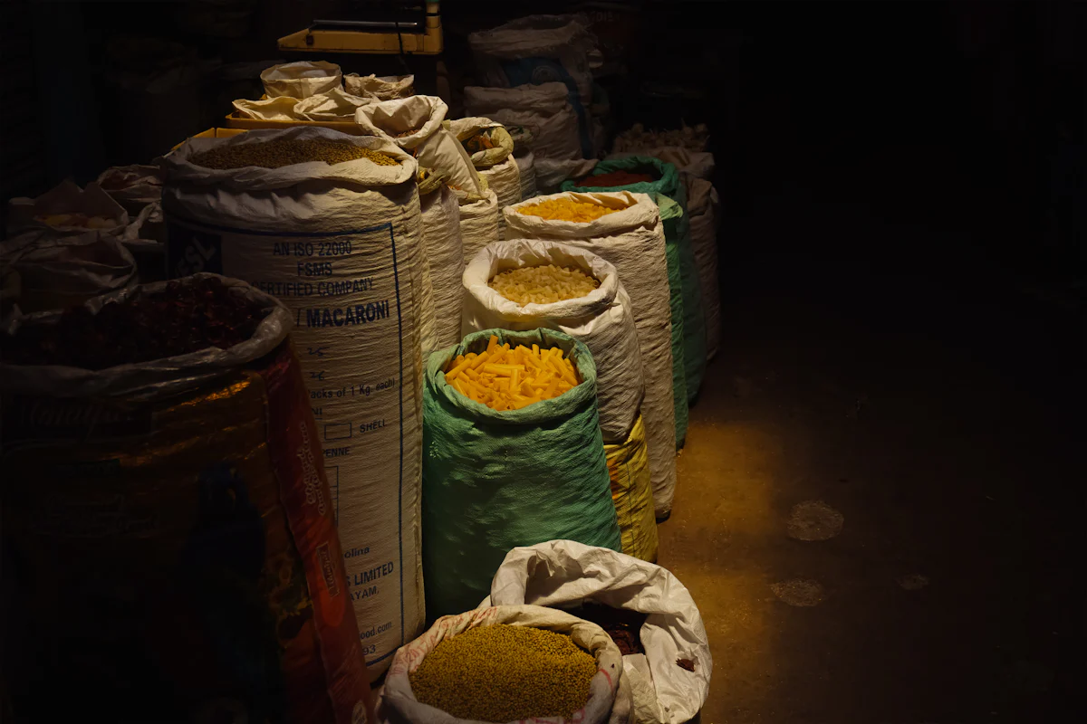 Sacks of grain stacked in a storage room