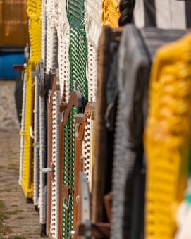 Colorful beach chairs lined up in a row.