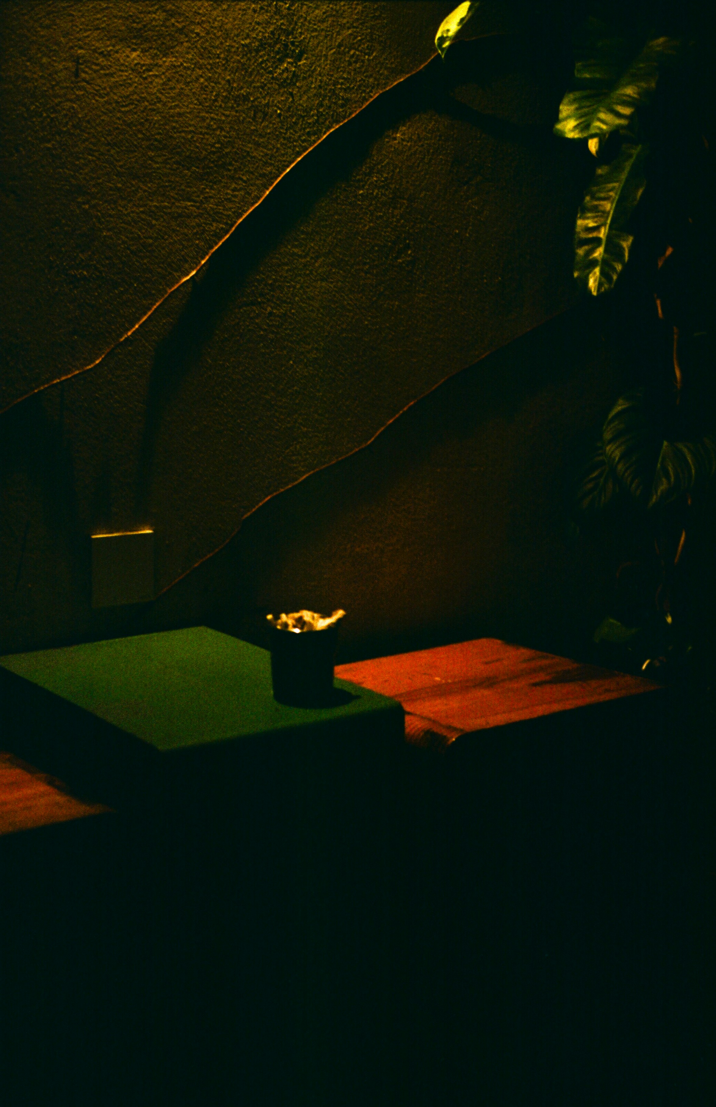 An ashtray sits on a green table.