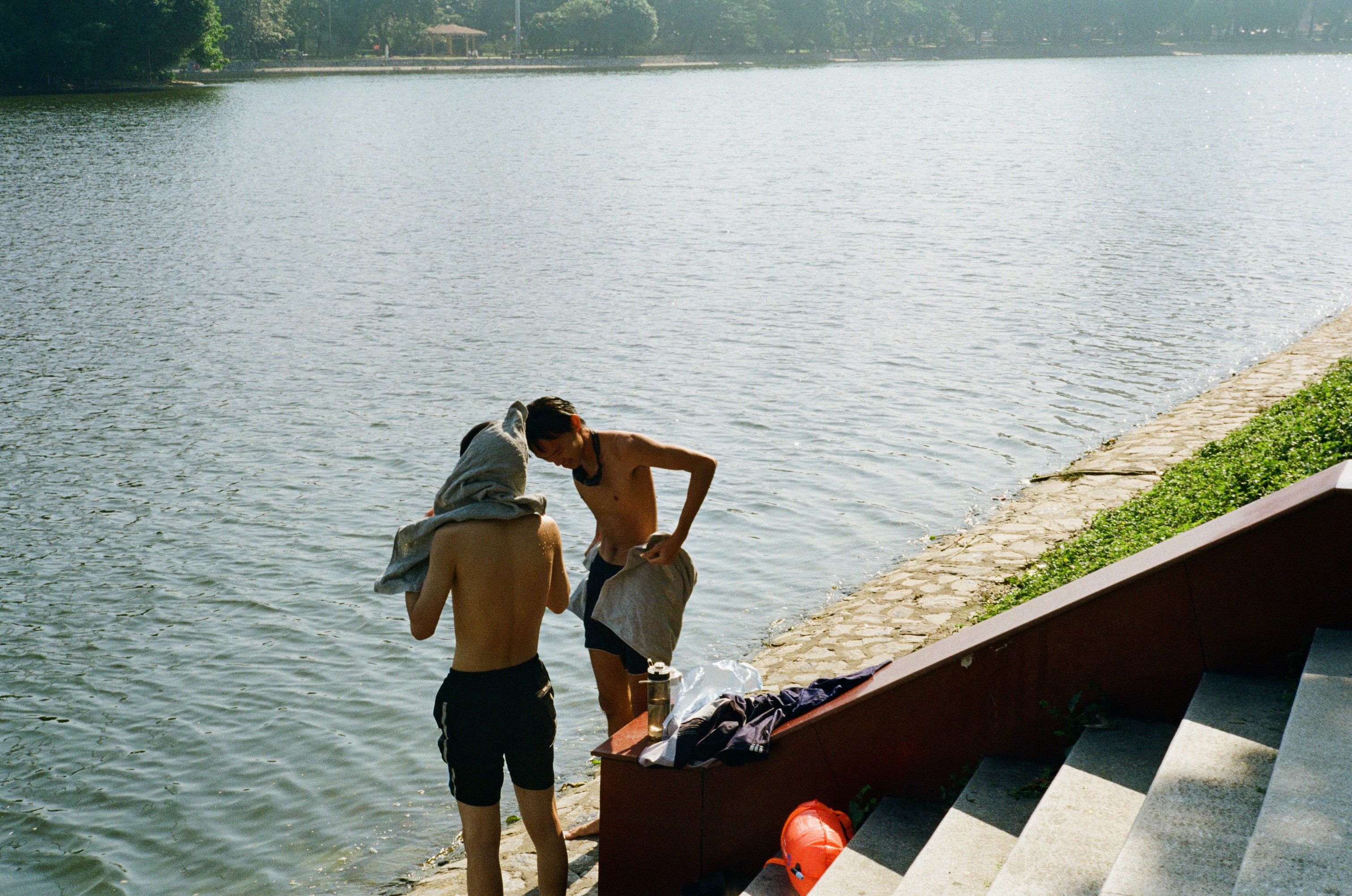 Two people by the water's edge