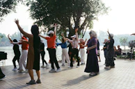 People exercising outdoors by a lake