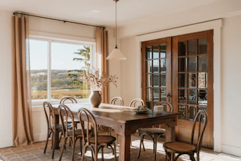 Dining room with rustic wooden table and chairs