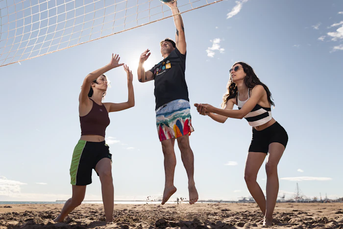 testimonial-02 — Nathan playing beach volleyball with friends on a sunny day
