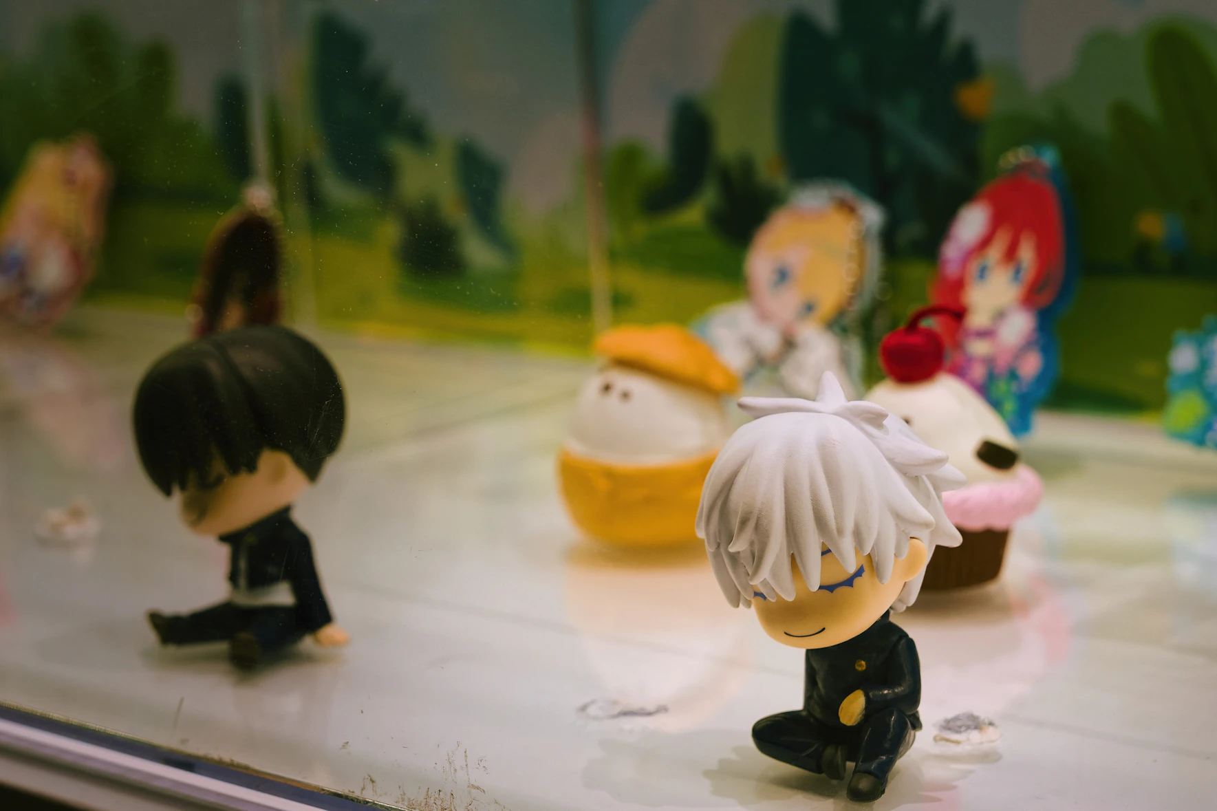 Collectible figures displayed on a shelf