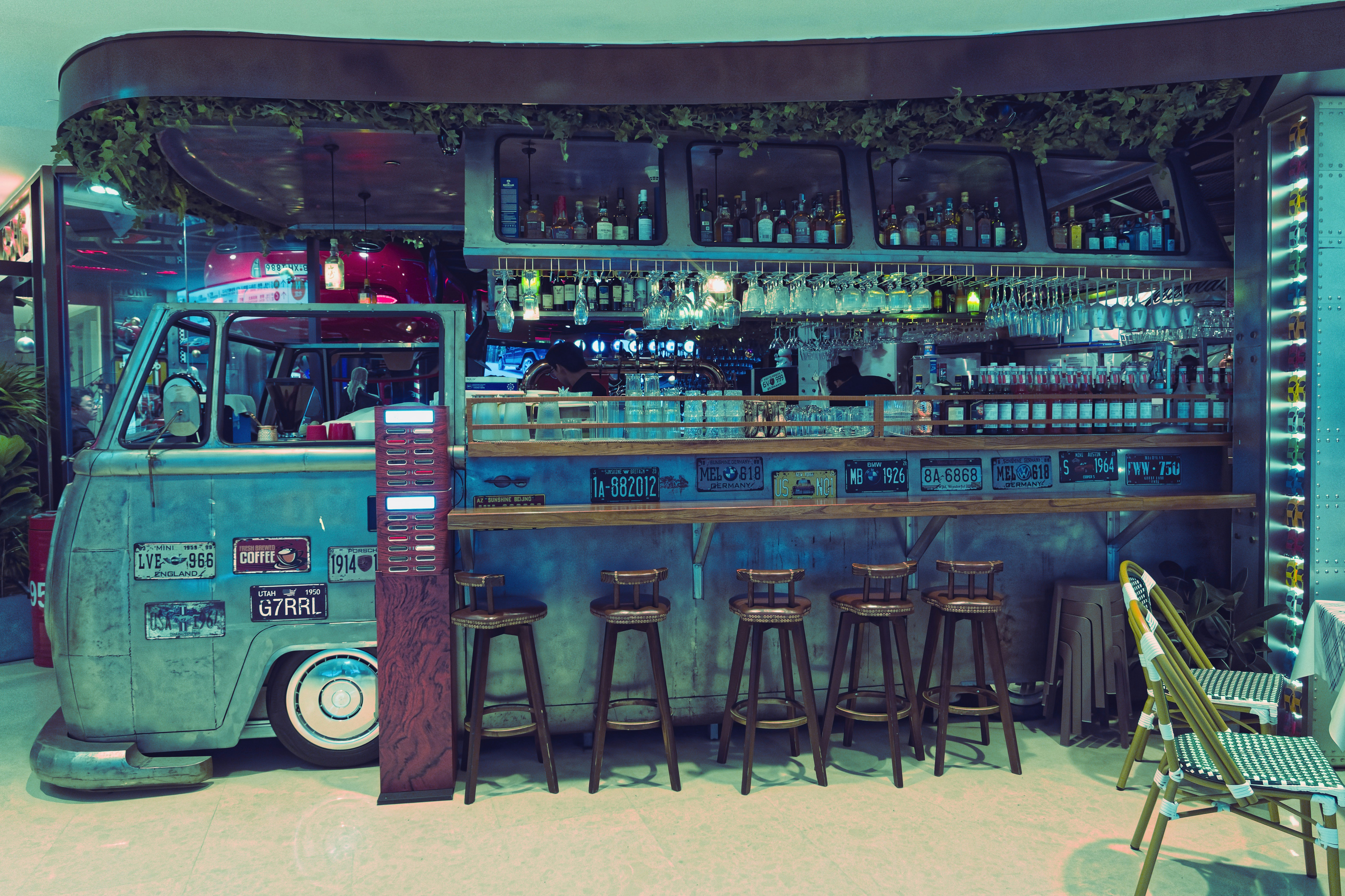 Retro van converted into a bar with stools