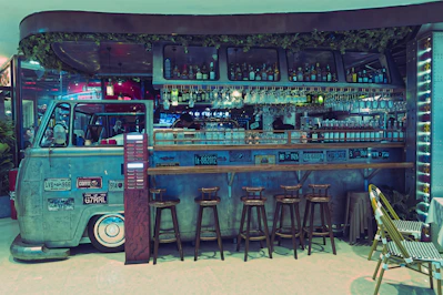 Retro van converted into a bar with stools