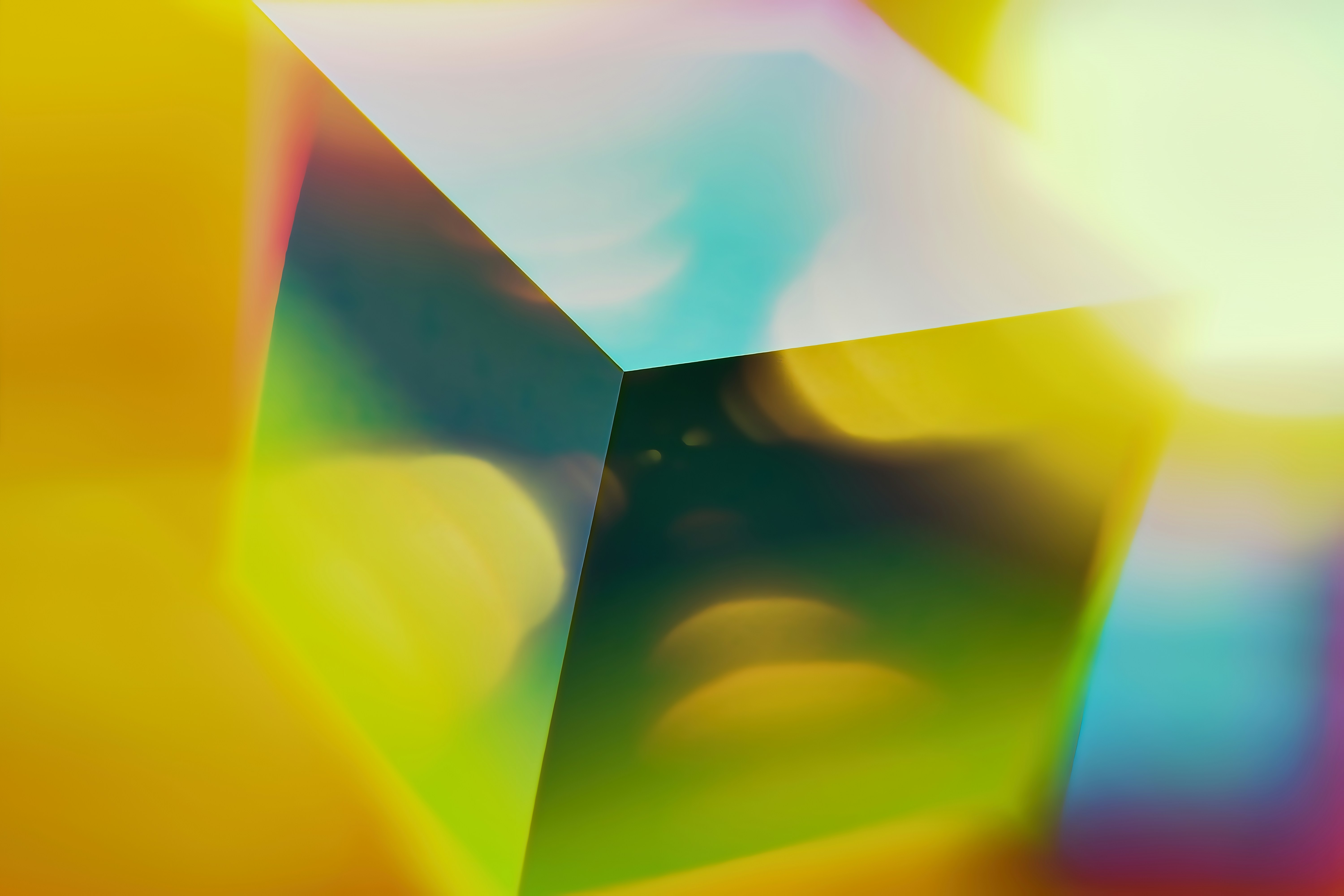 A translucent cube with colorful light reflections