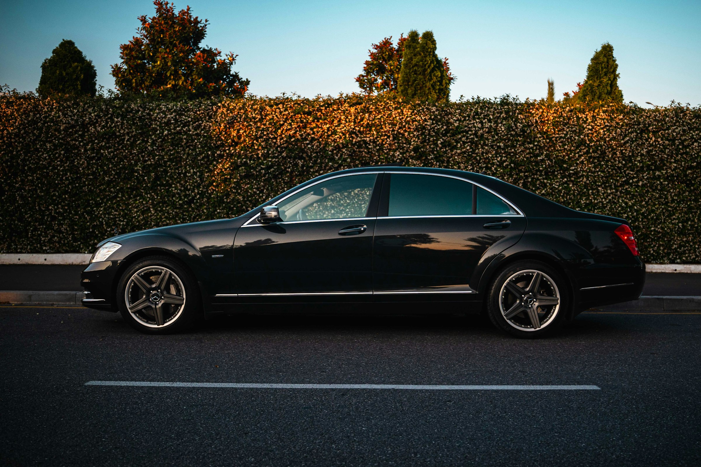 Black Mercedes-Benz S-Class parked at the kerb