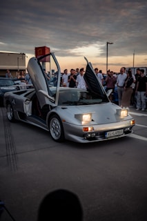 Silver lamborghini diablo with doors open