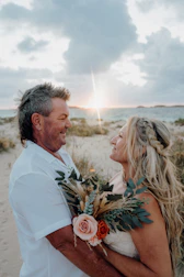 Couple embracing on a beach at sunset