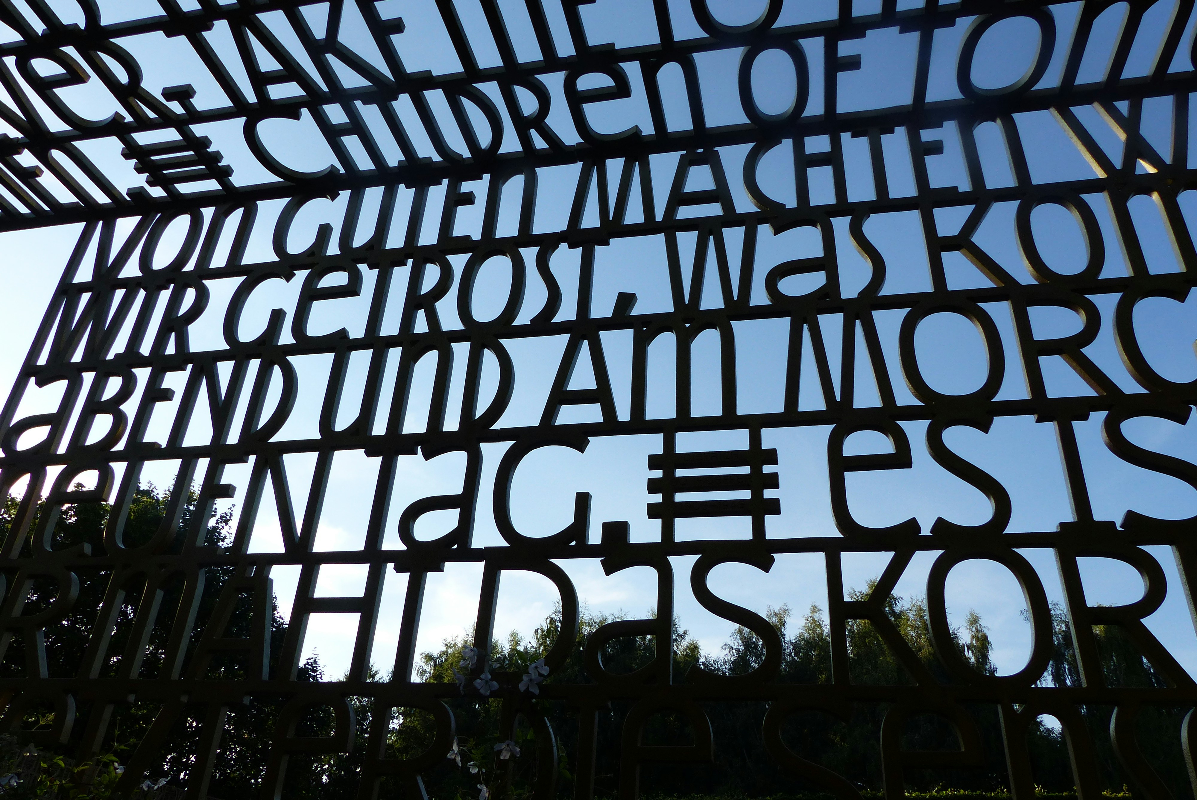 Metal letters forming text against blue sky