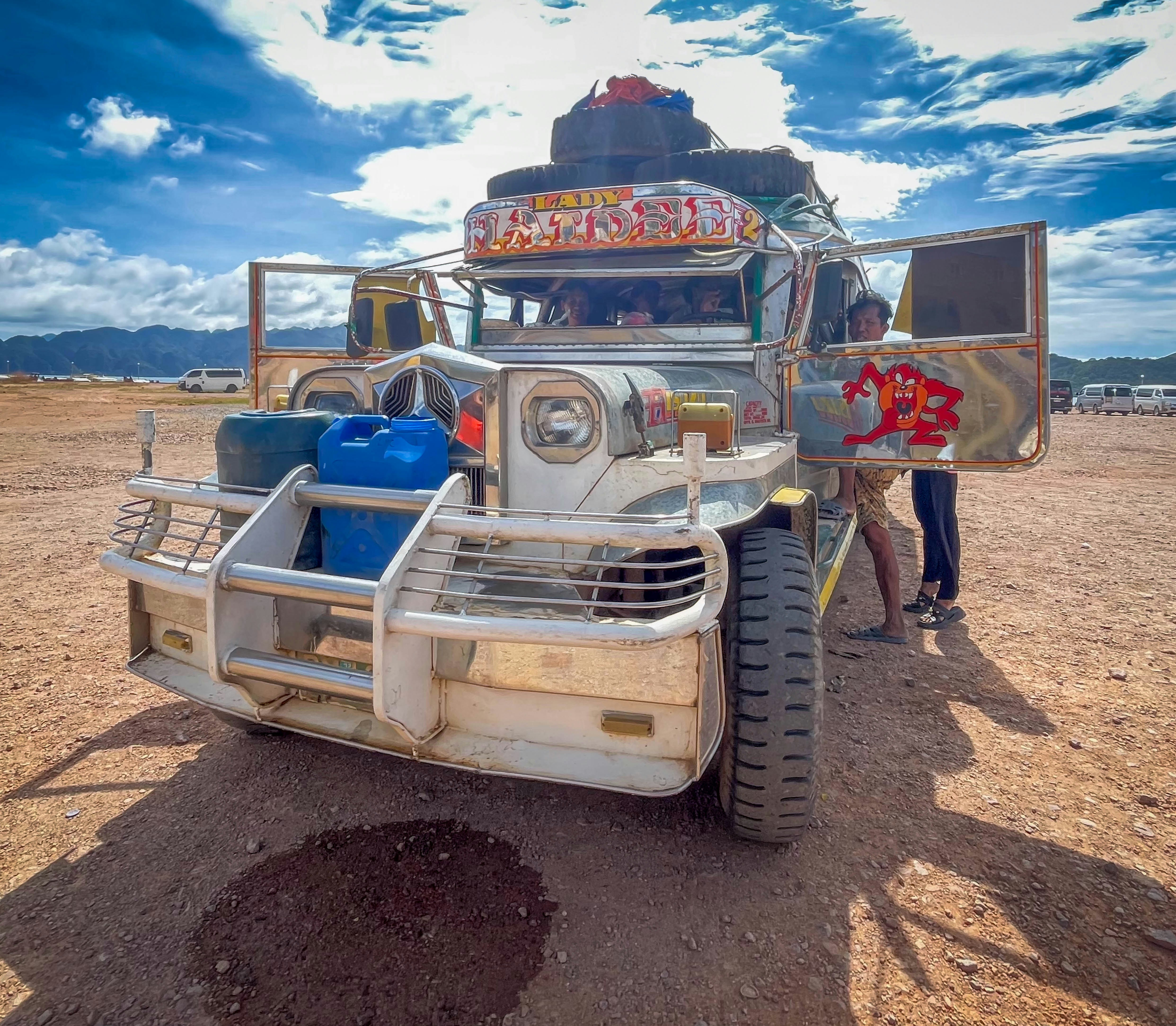 A decorated jeepney loaded with luggage
