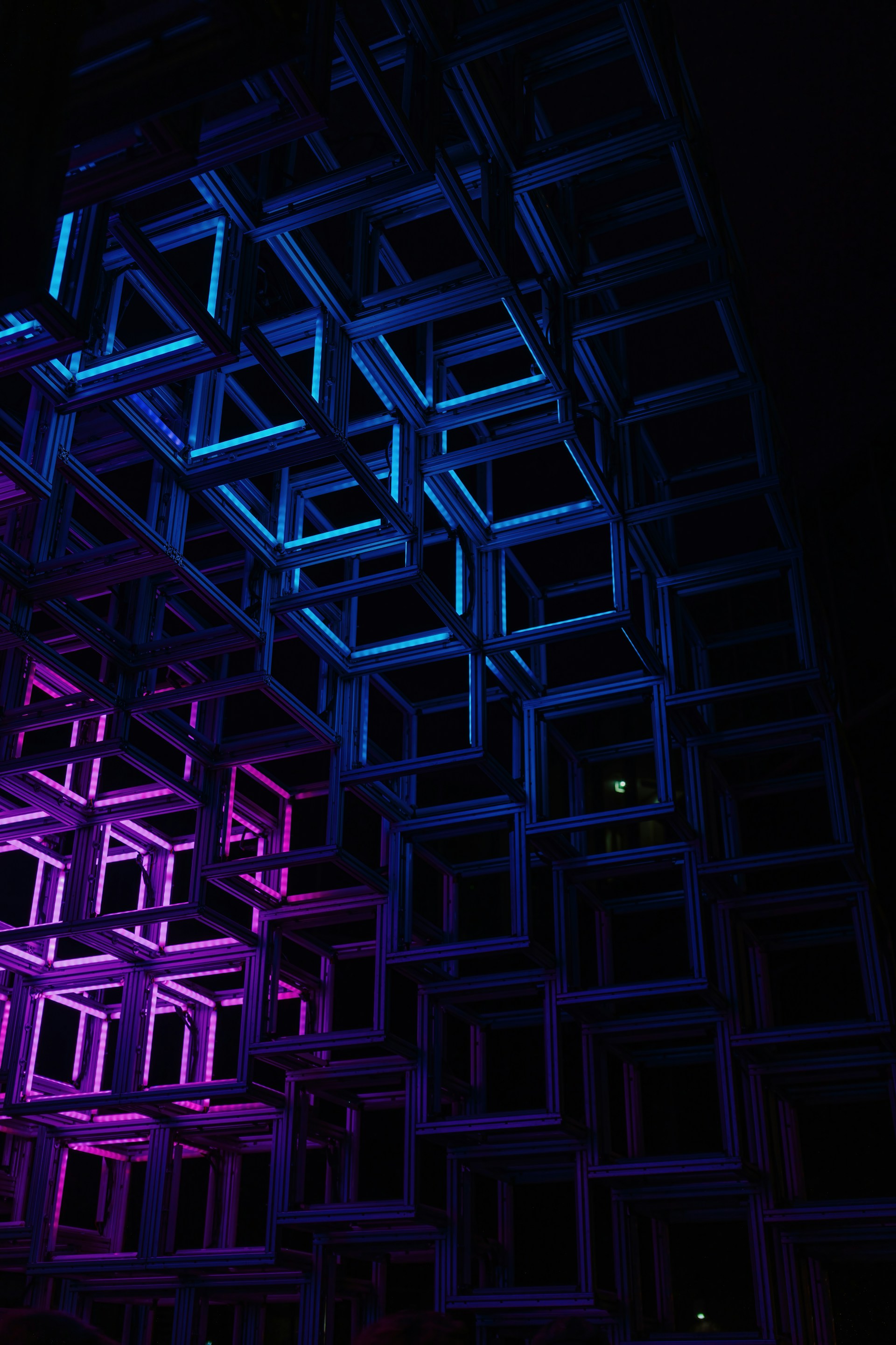 Geometric structure illuminated with blue and purple lights