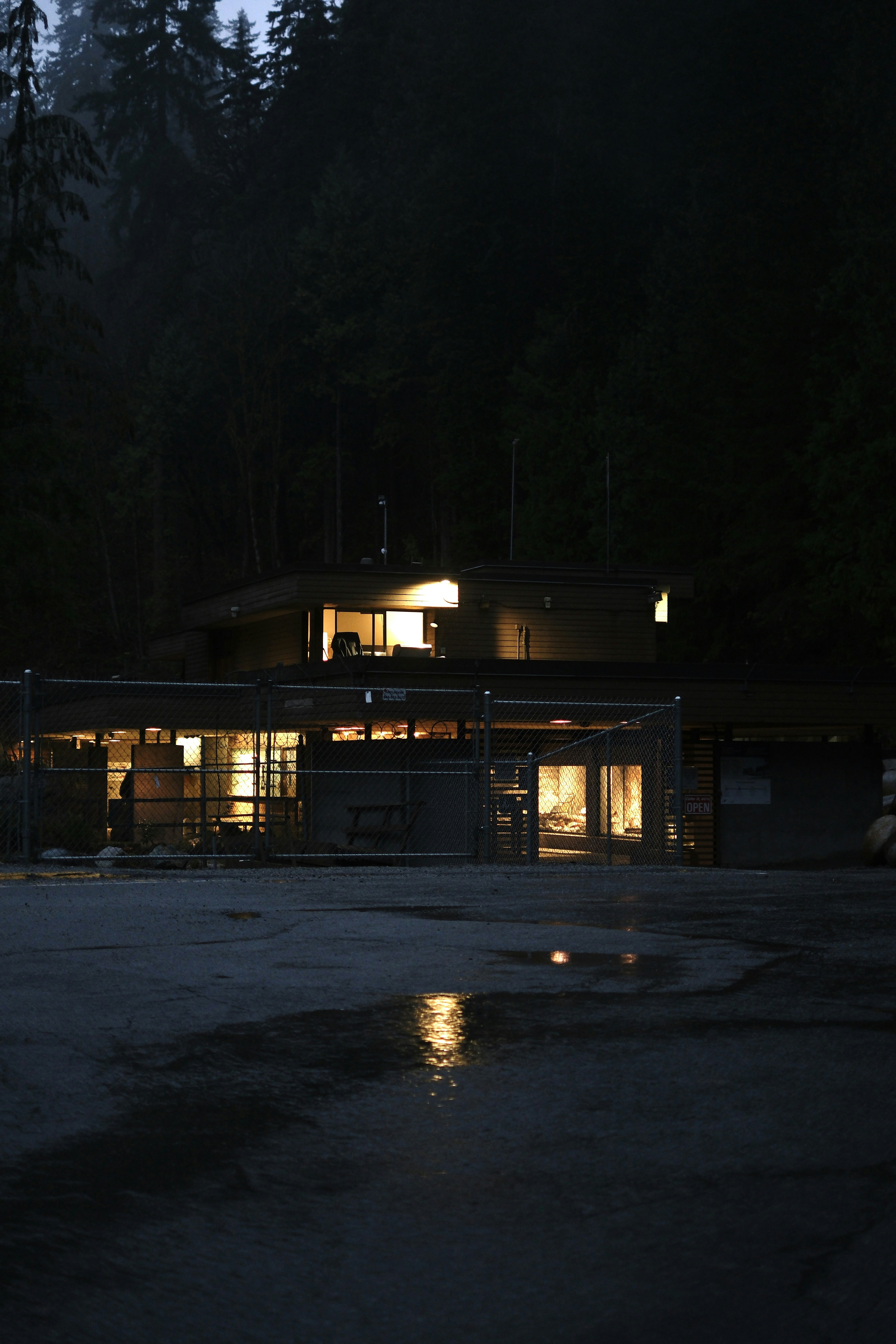 Modern house with lights on at night