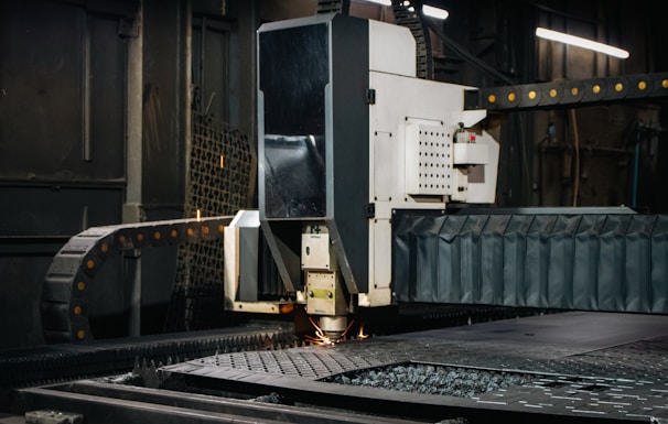 Industrial laser cutter working on metal sheet