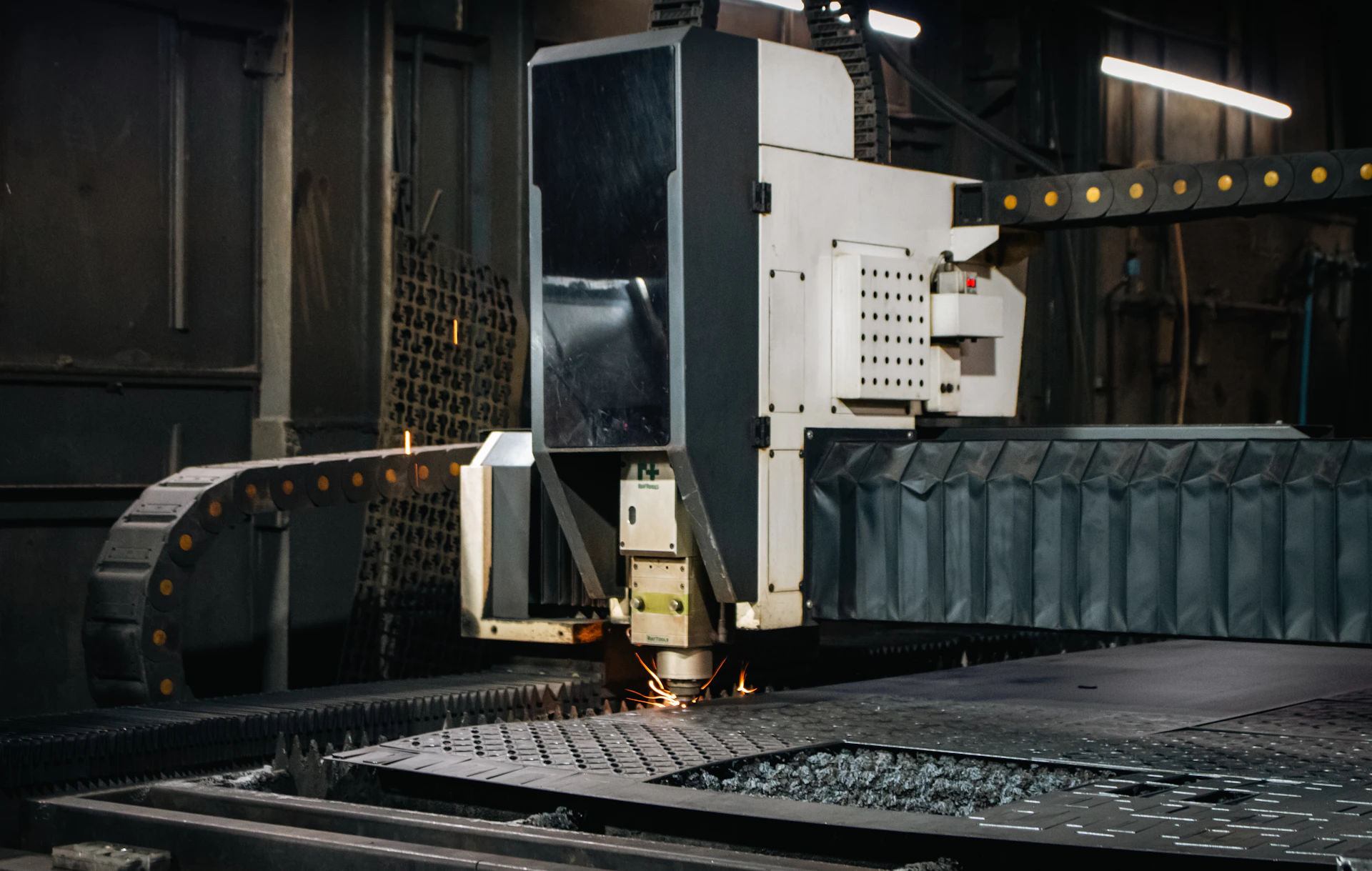 Industrial laser cutter working on metal sheet