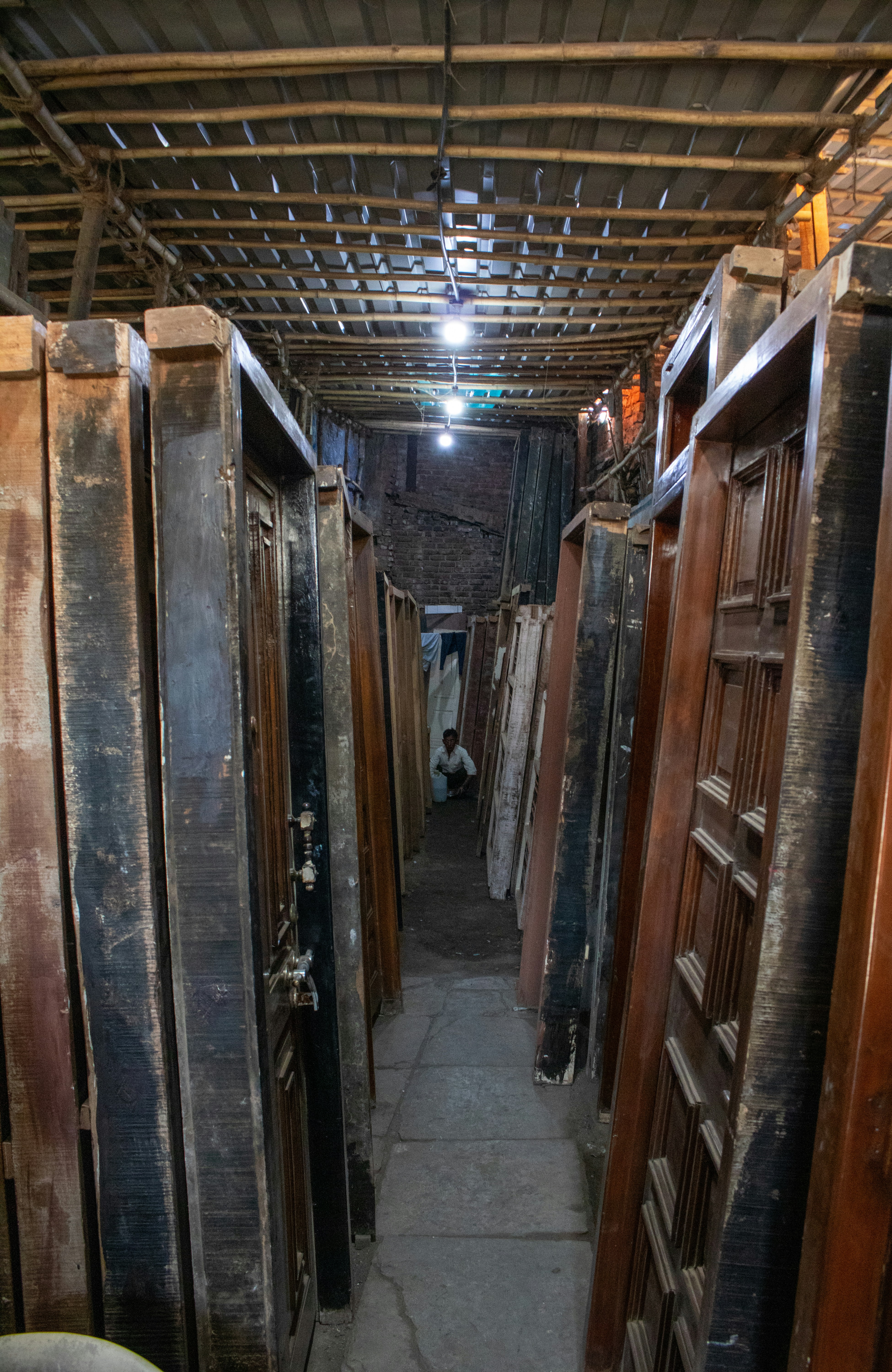 A warehouse filled with antique wooden doors