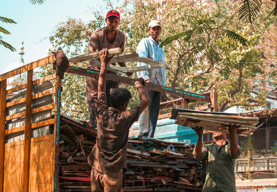 Workers loading reusable material onto a truck