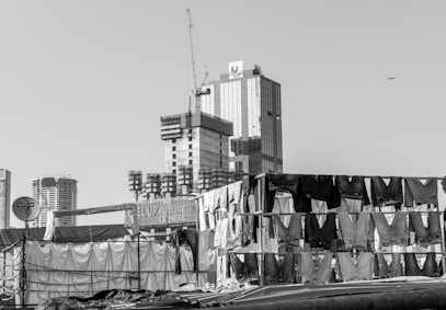 Clothes drying on lines with buildings behind