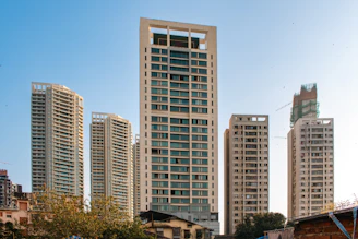 Modern high-rise buildings against a clear sky.