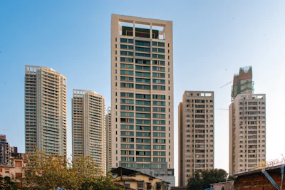 Modern high-rise buildings against a clear sky.