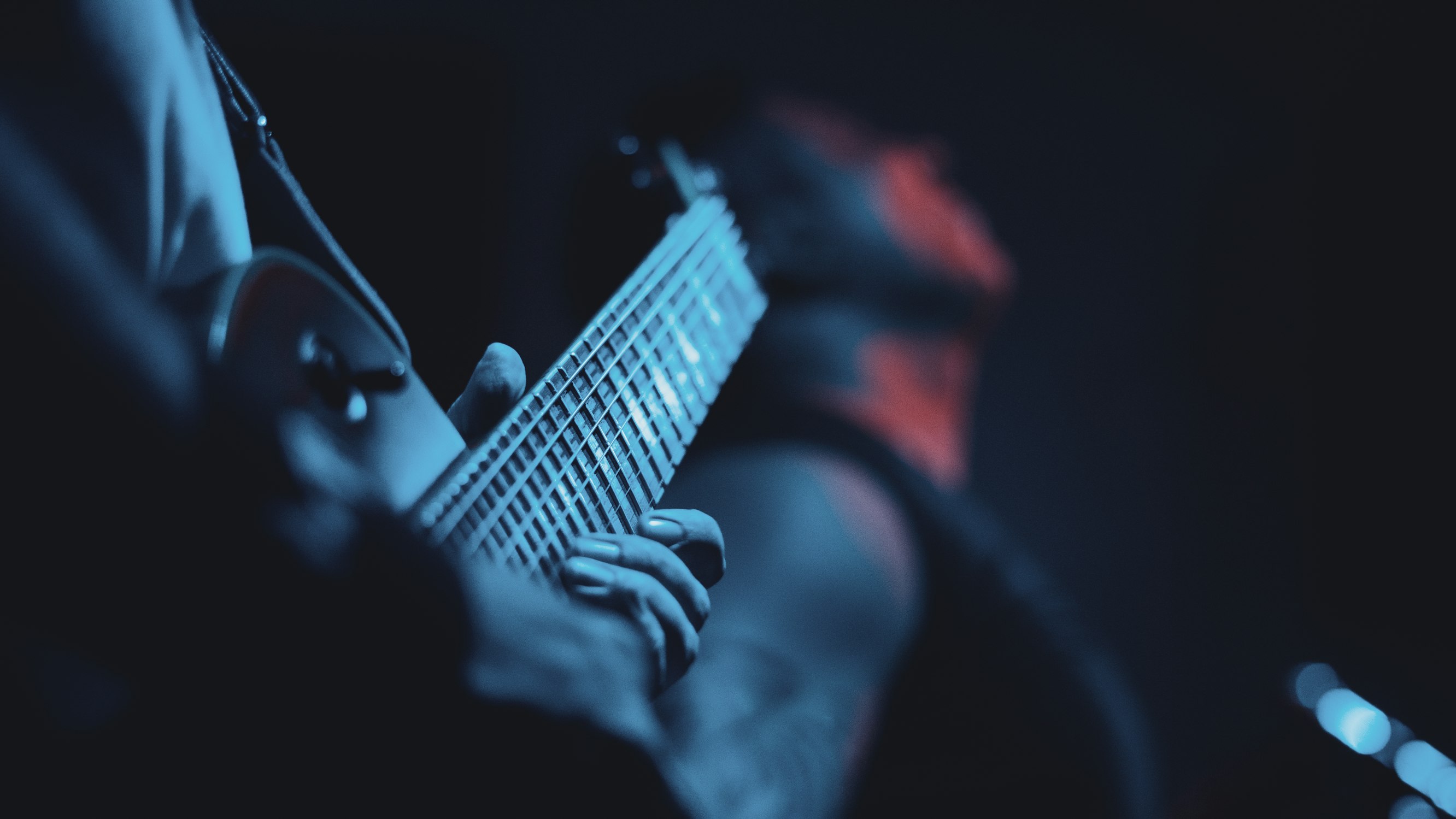 Musician practising interval ear training at a piano keyboard