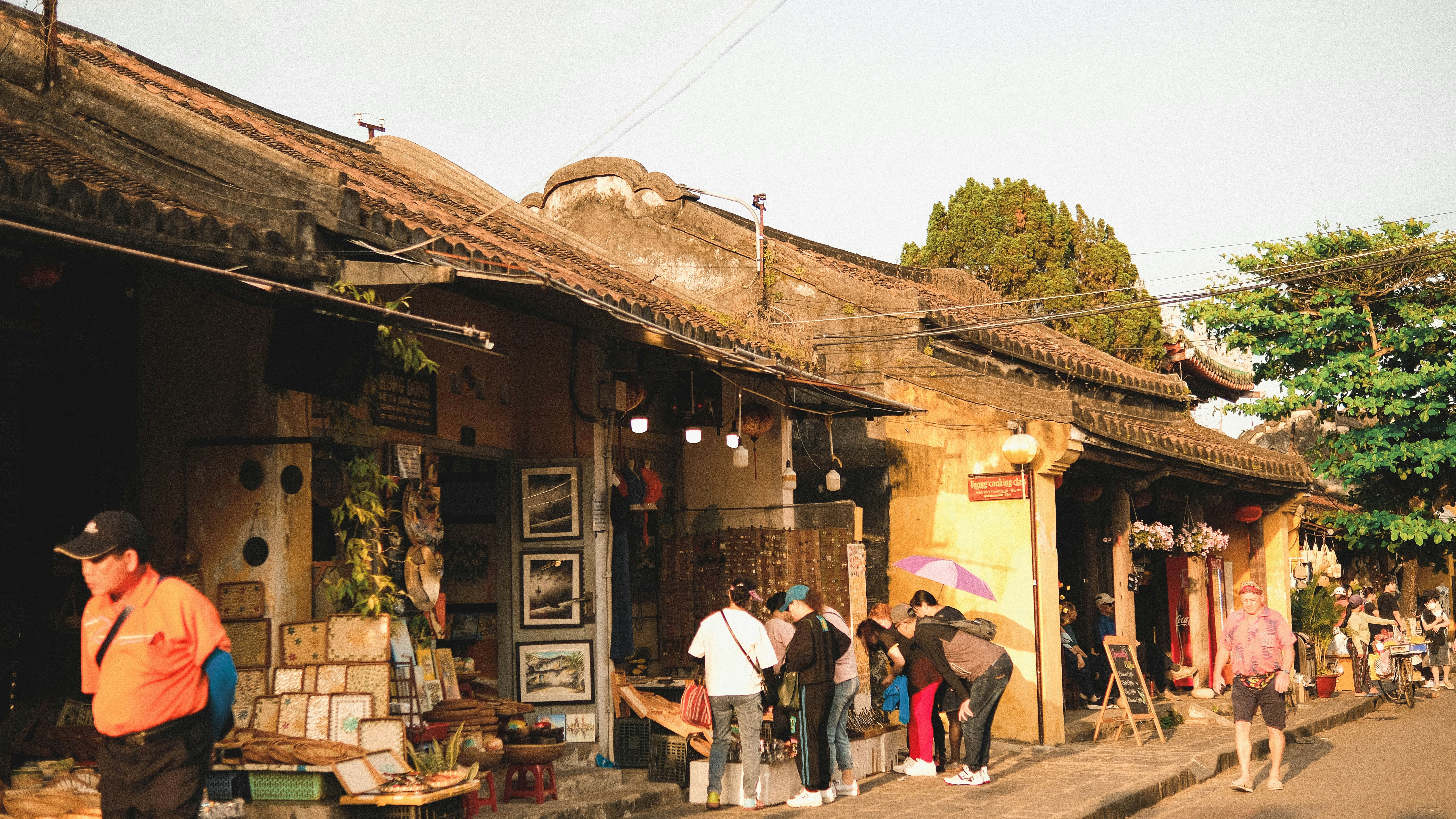 People browsing shops along a historic street