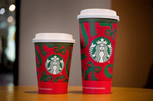 Two starbucks cups with holiday designs.