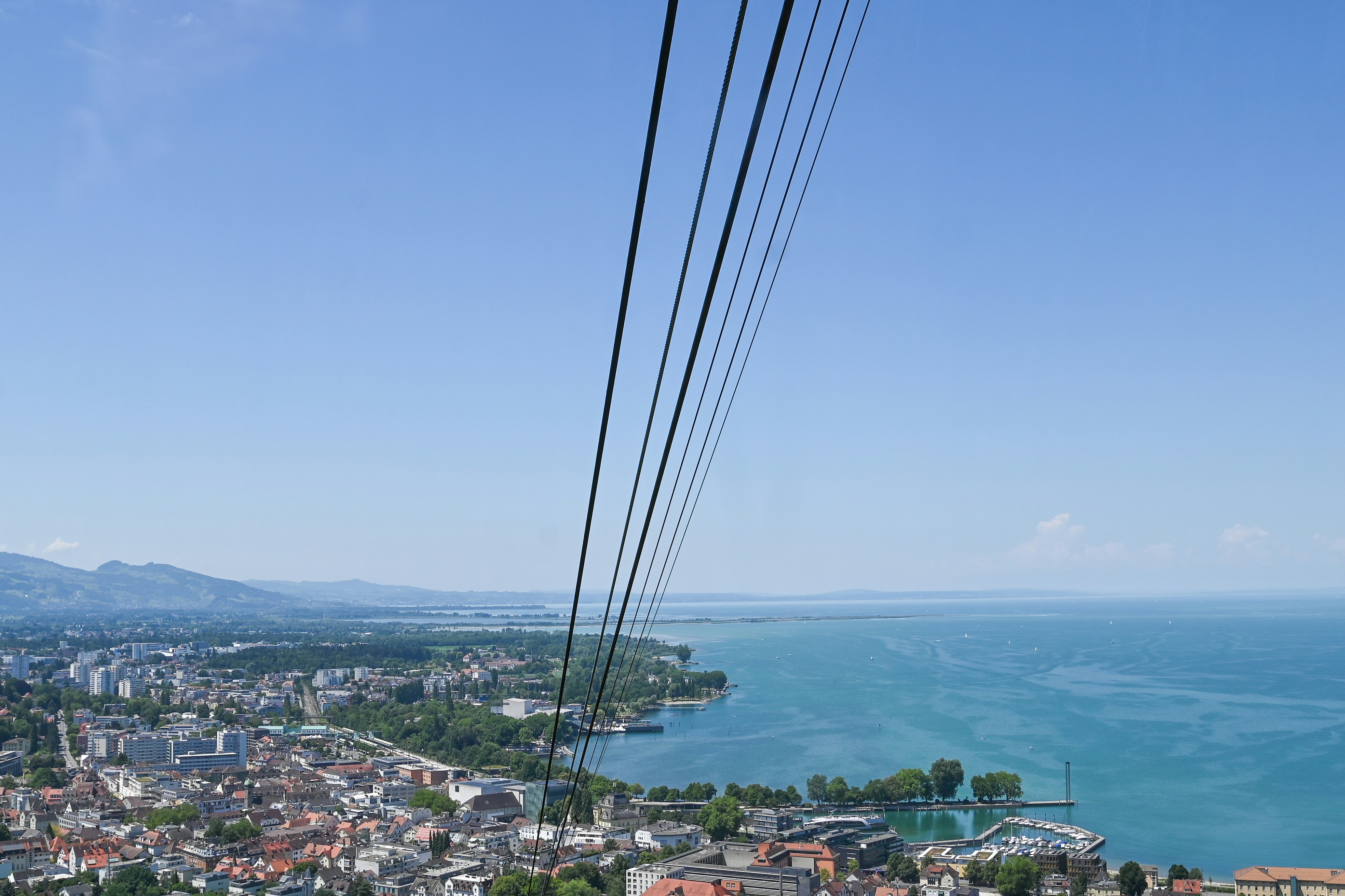 Cable car lines over a city and lake