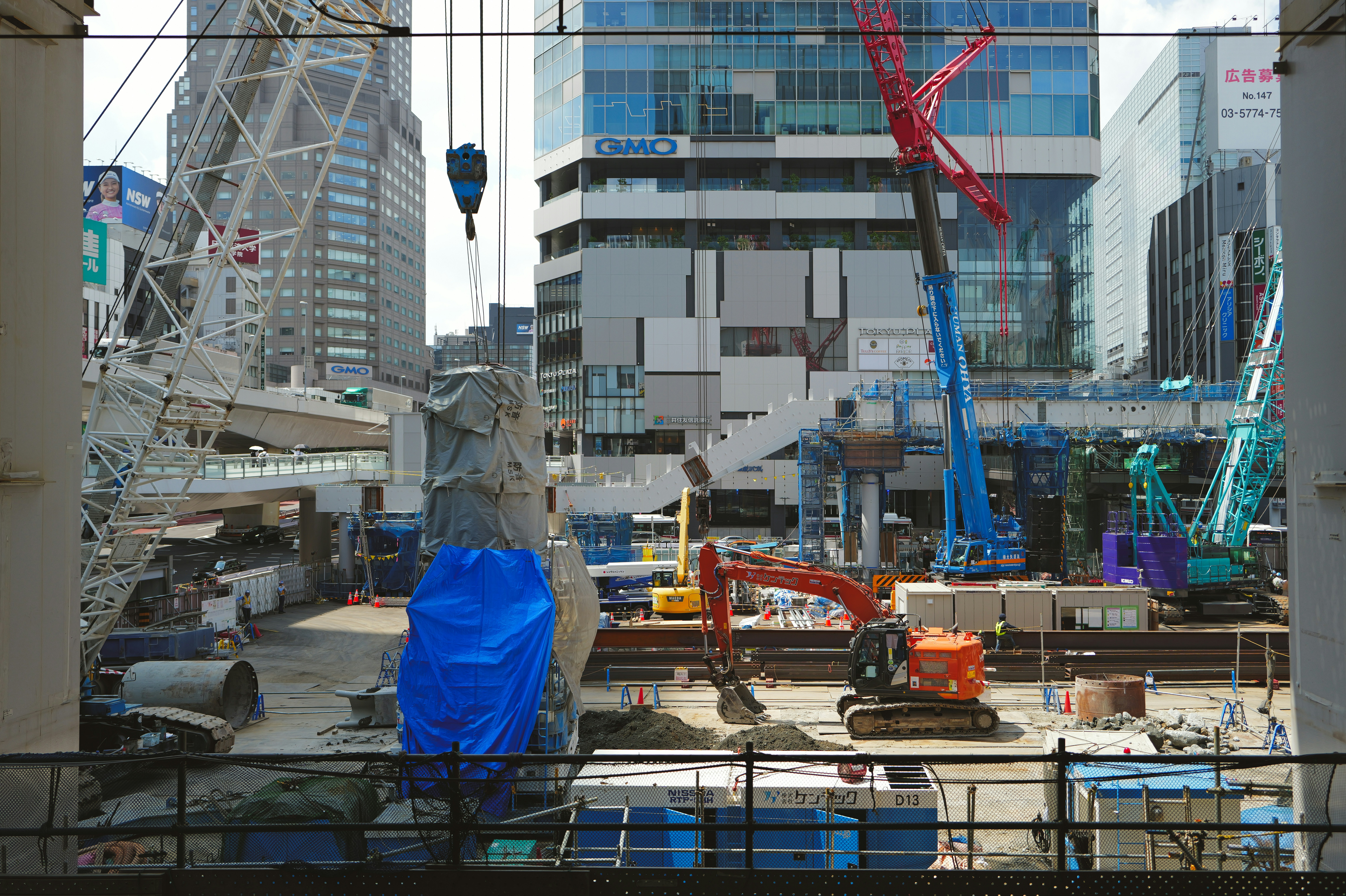 Construction site with cranes and buildings