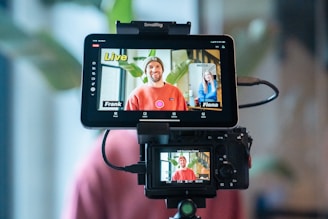 Two people on a video call displayed on monitor