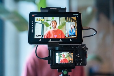Two people on a video call displayed on monitor