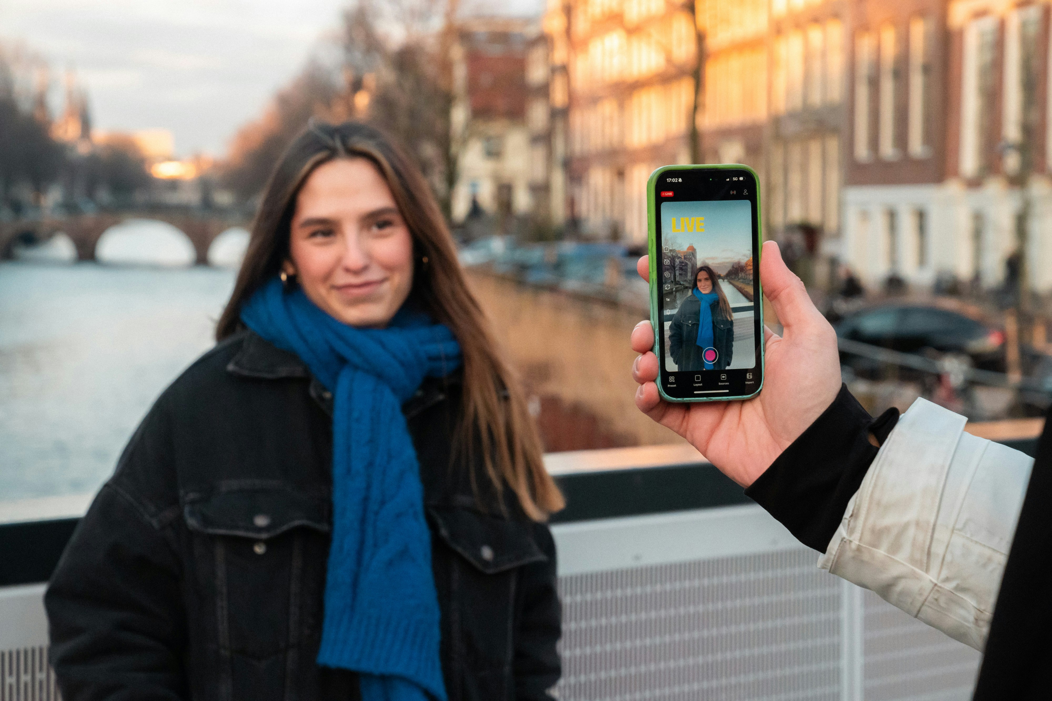 Woman posing for a selfie in front of a canal
