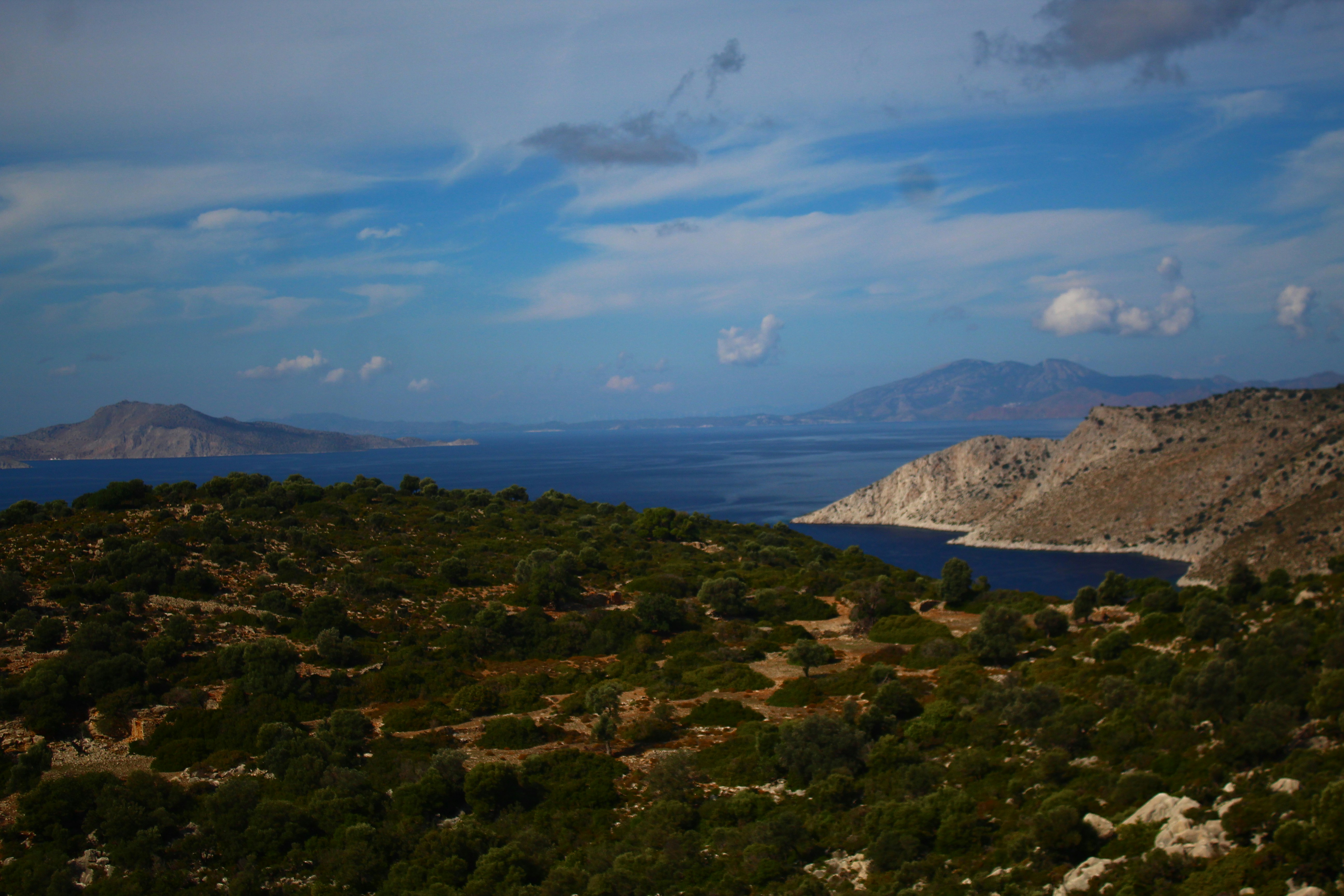 Coastal landscape with rocky hills and blue sea