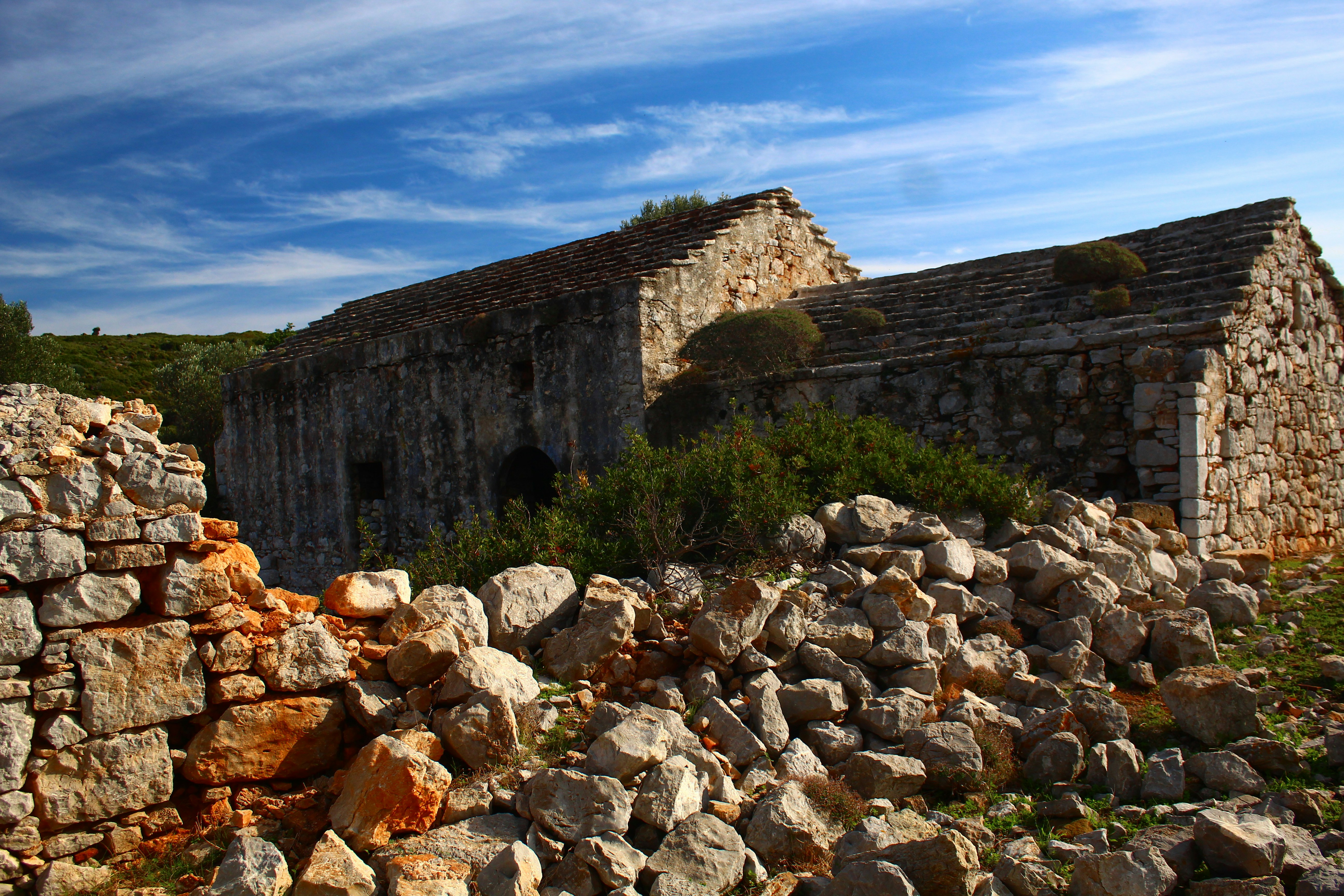 Old stone buildings under a blue sky
