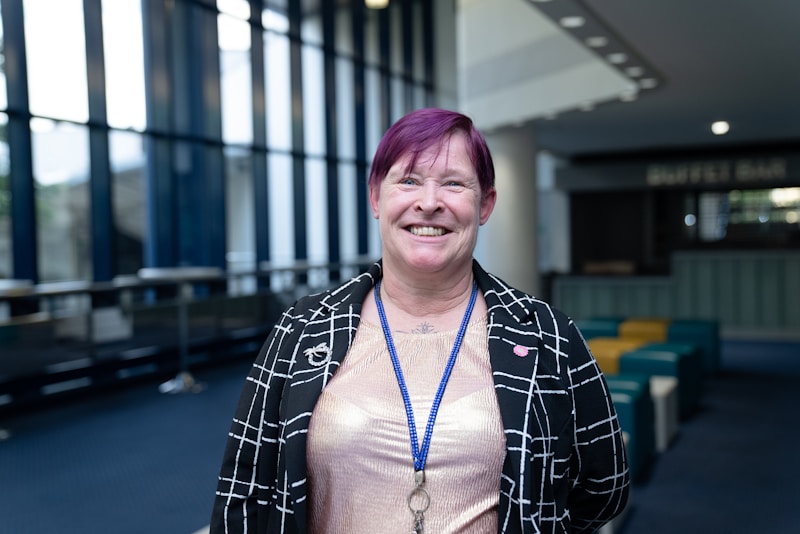 Bold woman with purple hair blazer
