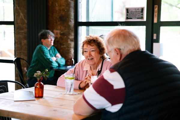 Adults sharing a meal together