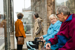 Elderly people waiting at a bus stop