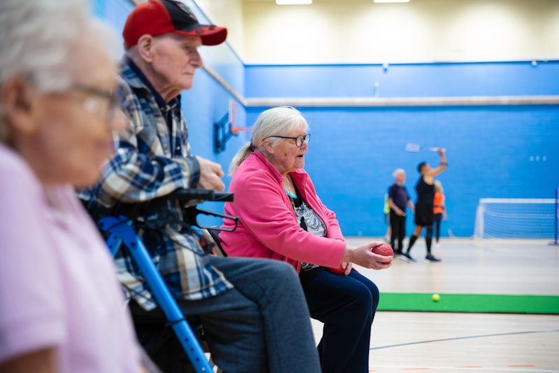 Seniors participating in a group circuit training class with exercise bands
