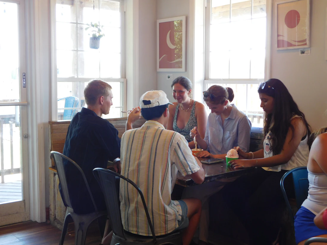 Friends sitting together around a table