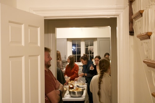 People gathered in a kitchen during a party
