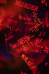 Red words murder and kill scattered on black background