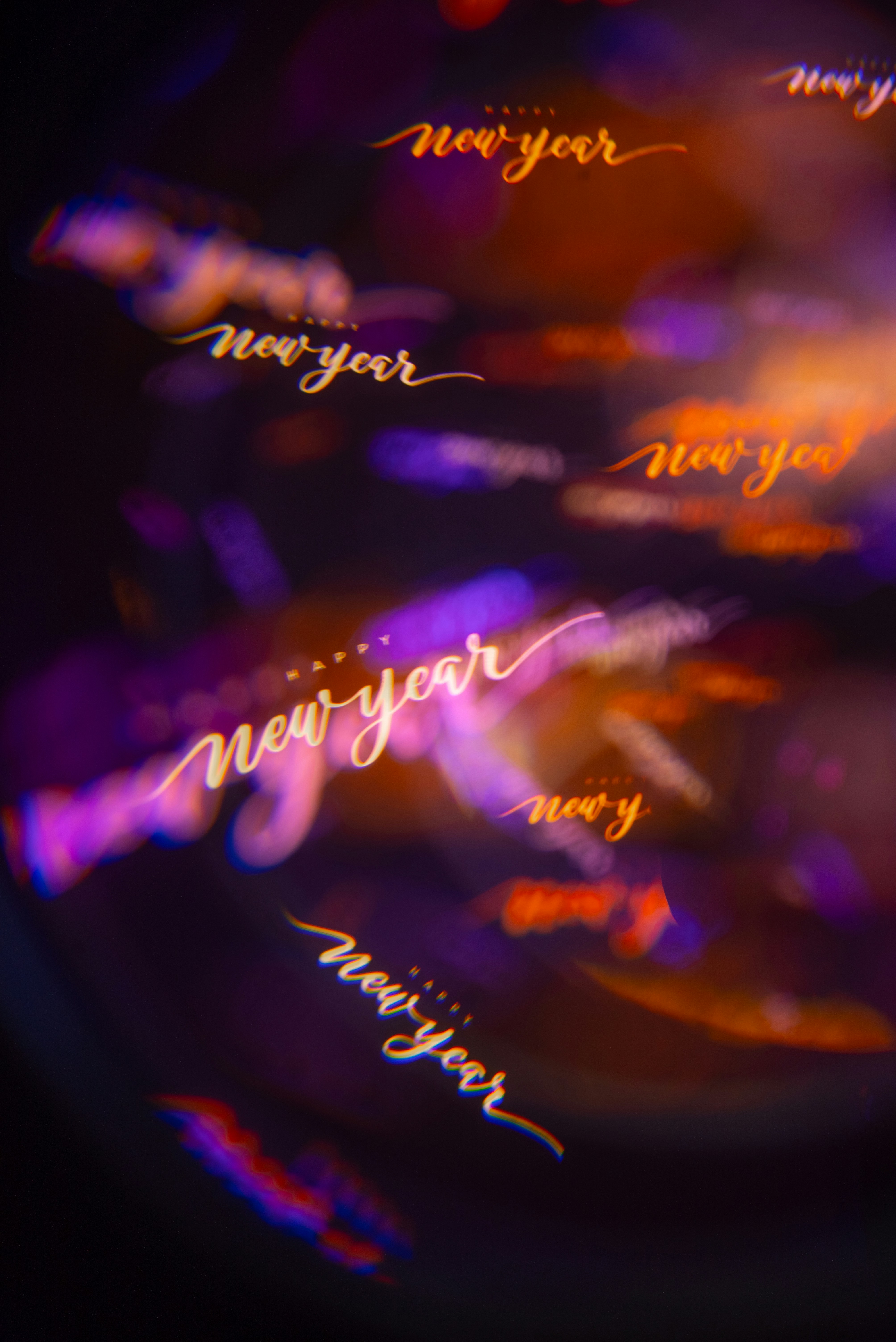Happy new year text with bokeh lights
