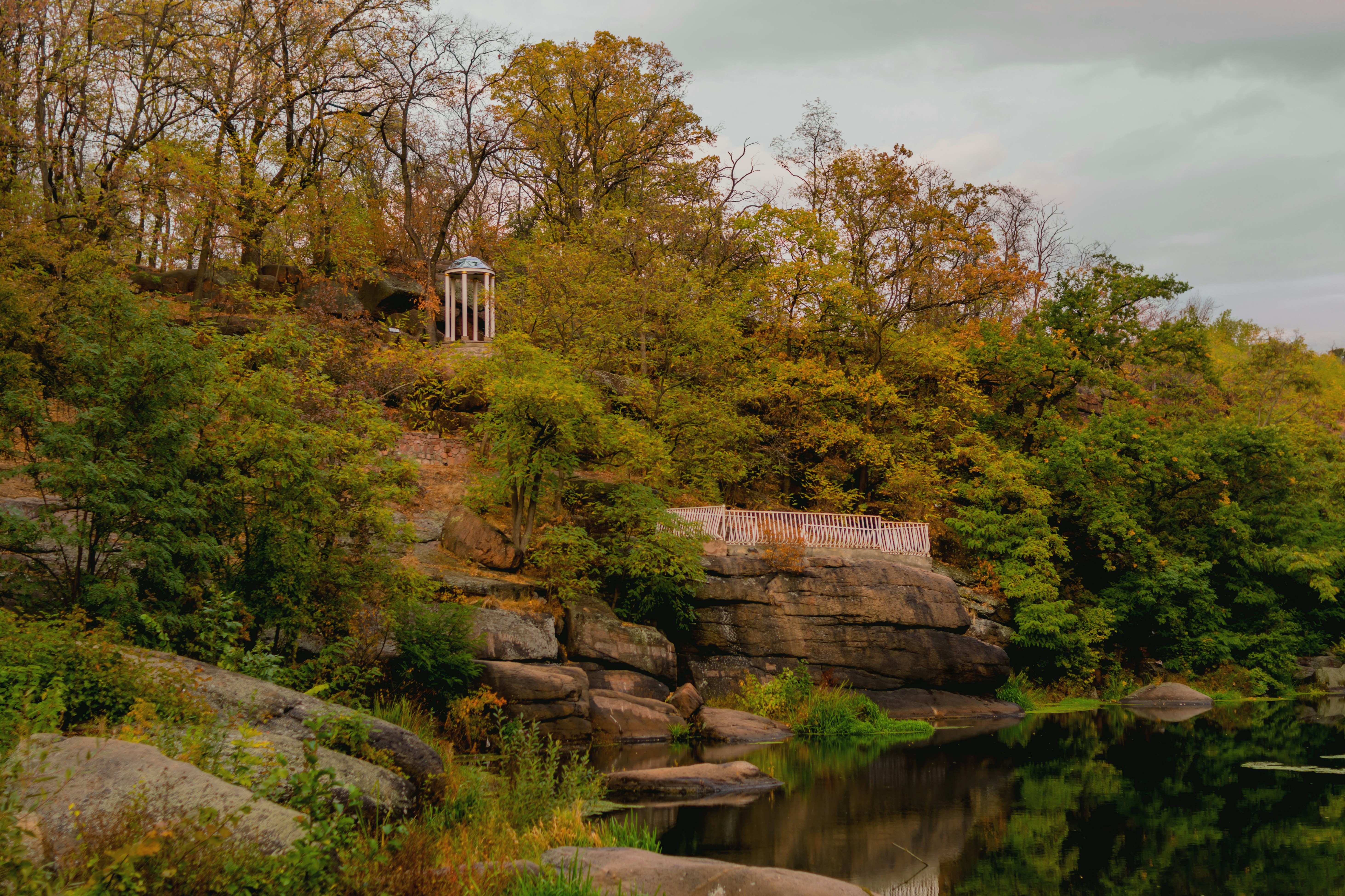 Stone structure on a wooded hill overlooking water