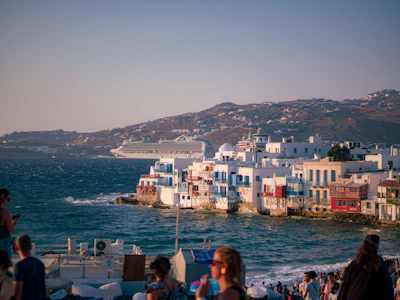 White buildings with blue accents along the coast.