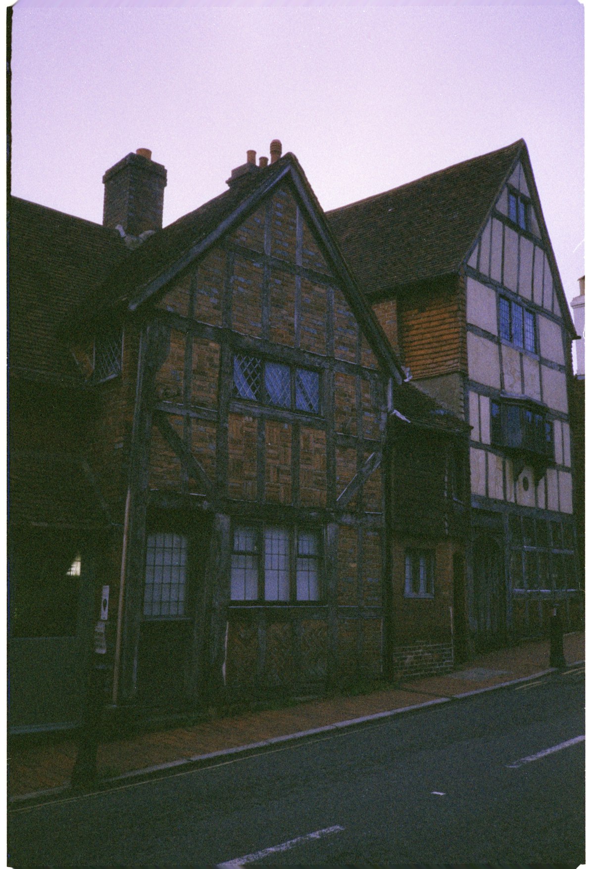 Historic timber-framed houses on a street, echoing Stafford's Ancient High House
