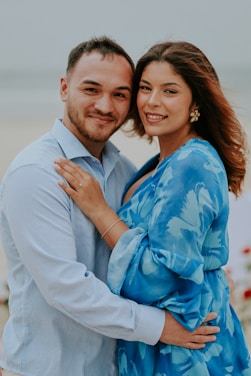 A couple embraces on a beach