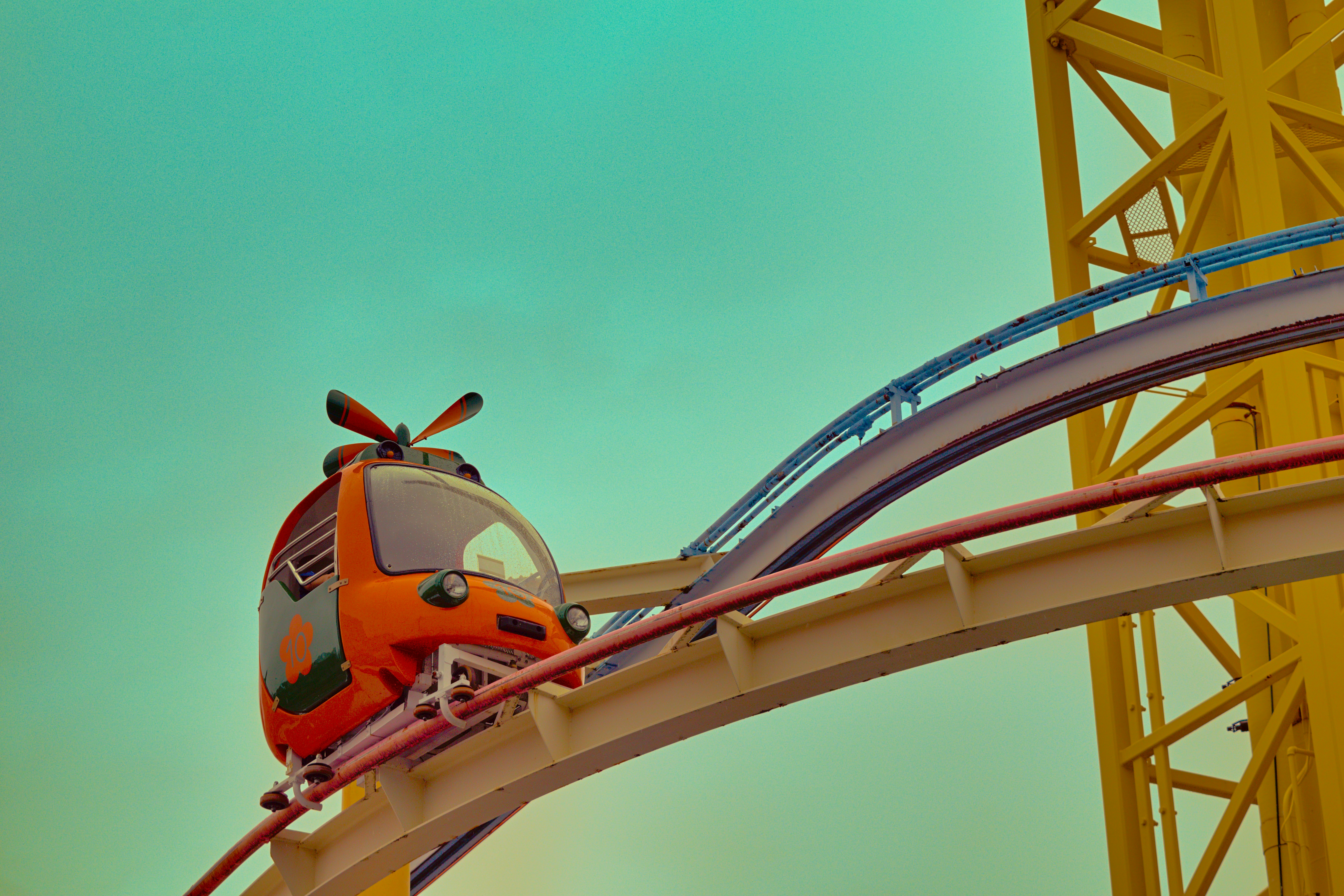 Orange roller coaster car on a track